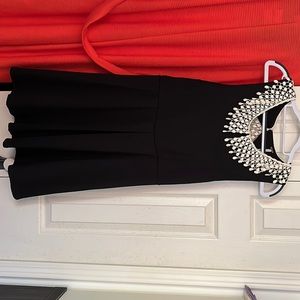 FREE PEOPLE waffle knit dress with open back.